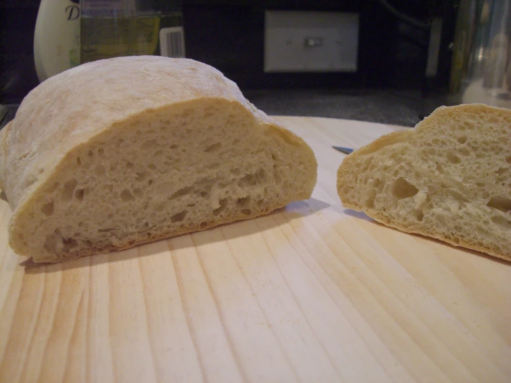 the top half of a loaf of bread with a slice cut out