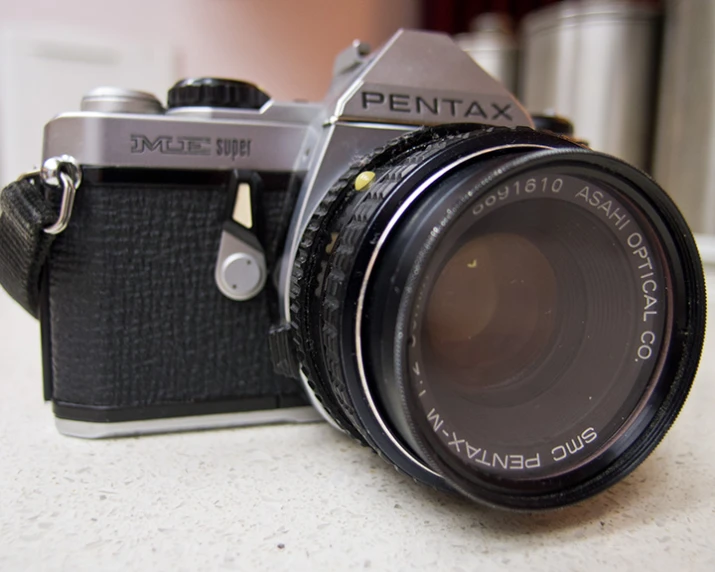 an old fashioned digital camera sitting on a table