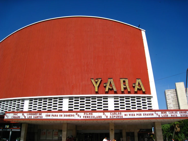 front of the theatre with people walking in front