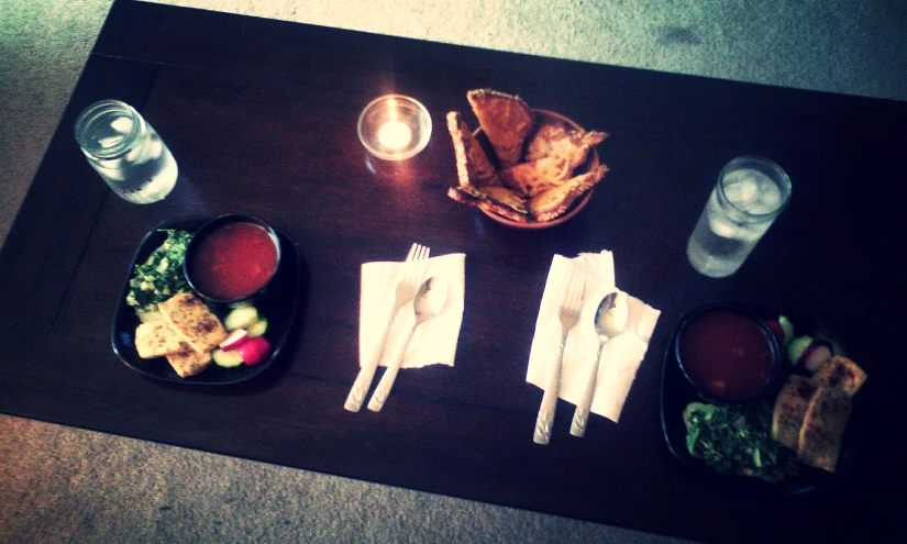 food on a table with empty water bottles