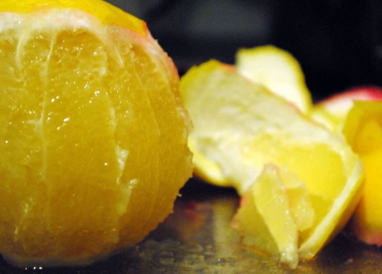 a group of peeled yellow apples on top of a table