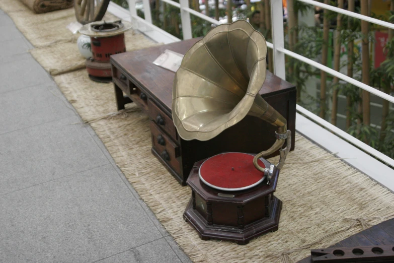 an instrument and record player on a bench