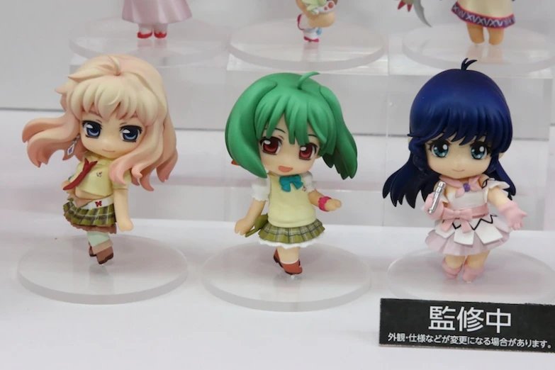 several anime figurines on display for sales