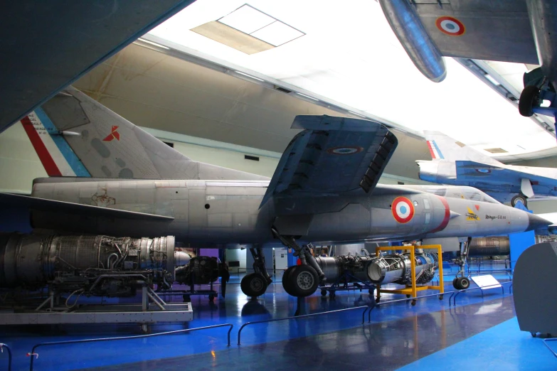 military jet aircraft displayed at museum exhibit in large building