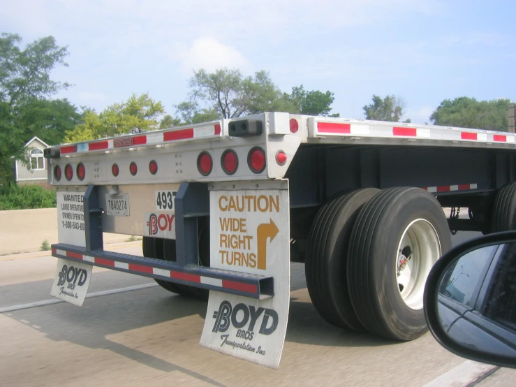 a big rig truck with ramps on the side of it