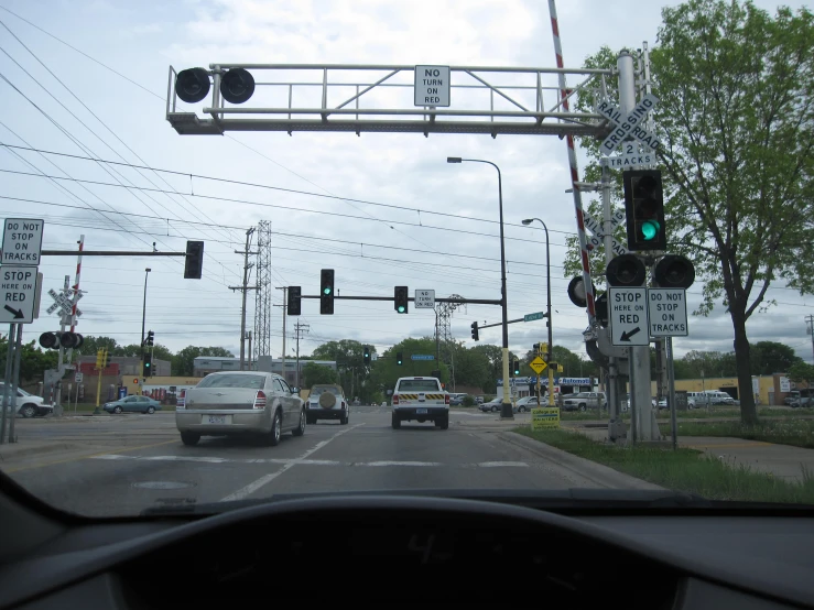 traffic lights on the side of a busy road