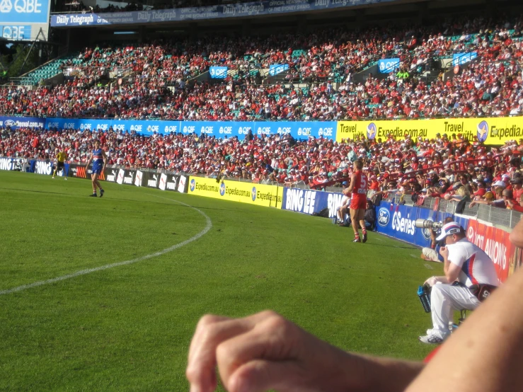 a soccer match is being played on an outdoor field