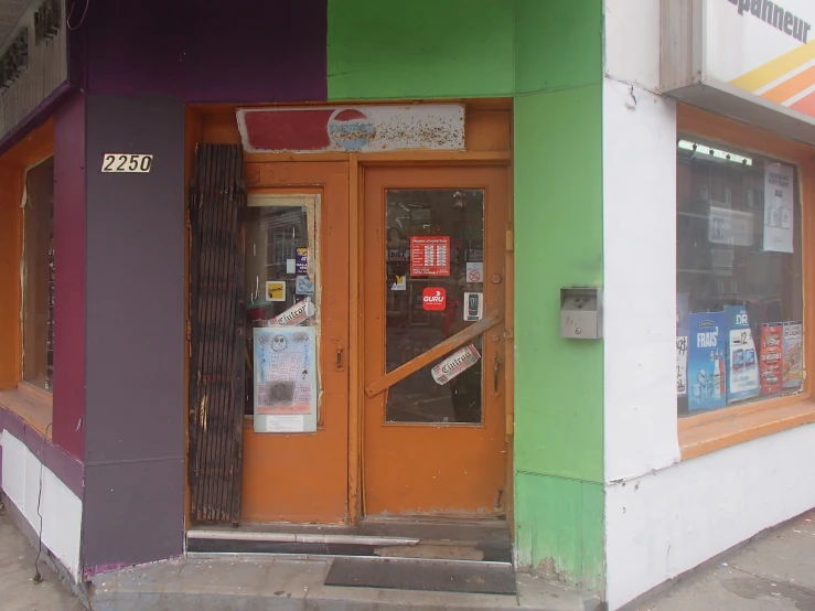 a building with lots of signage and some doors