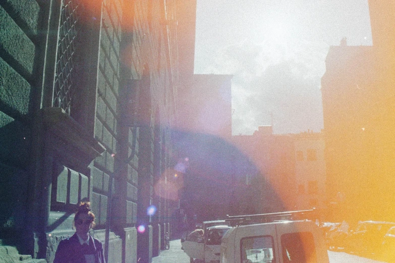 some tall buildings and a person walking through the street