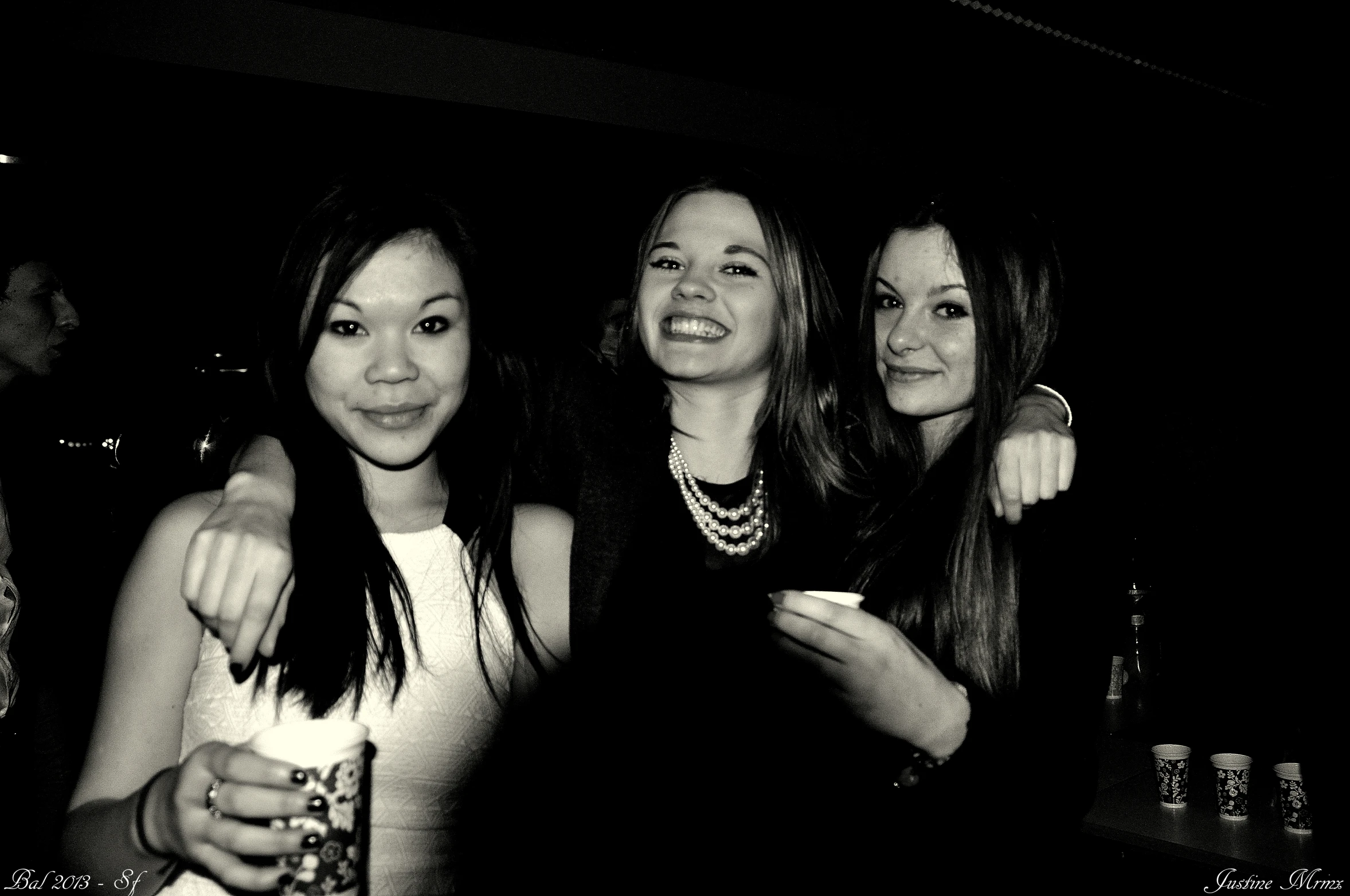 three young ladies posing for a po next to each other