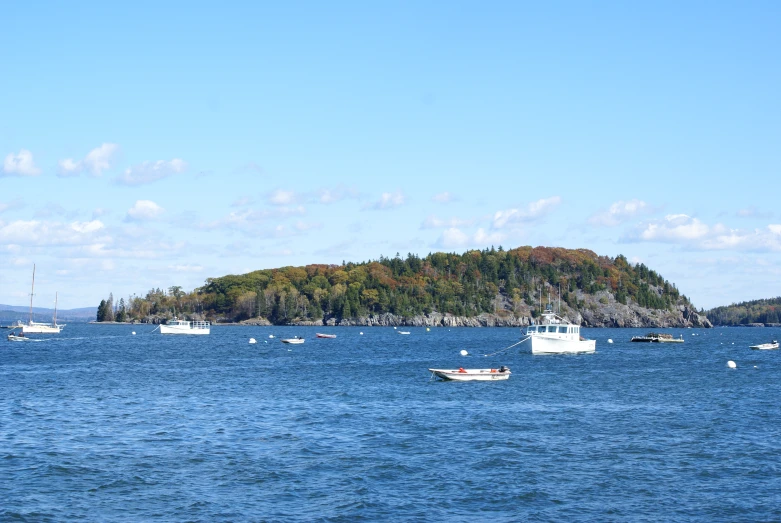 boats floating on the water, including boats