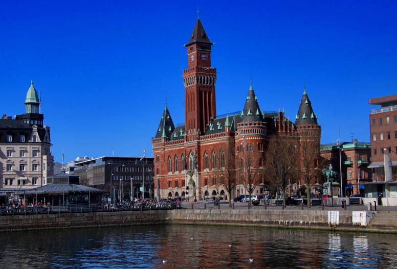 a large building with a tower and two clocktowers