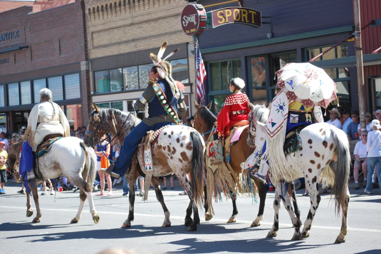 a number of people riding horses in a parade