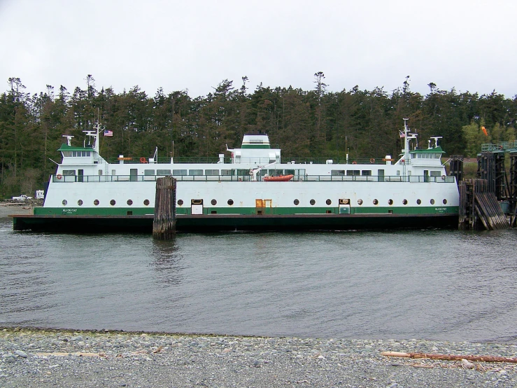 a big boat in the water by some docks