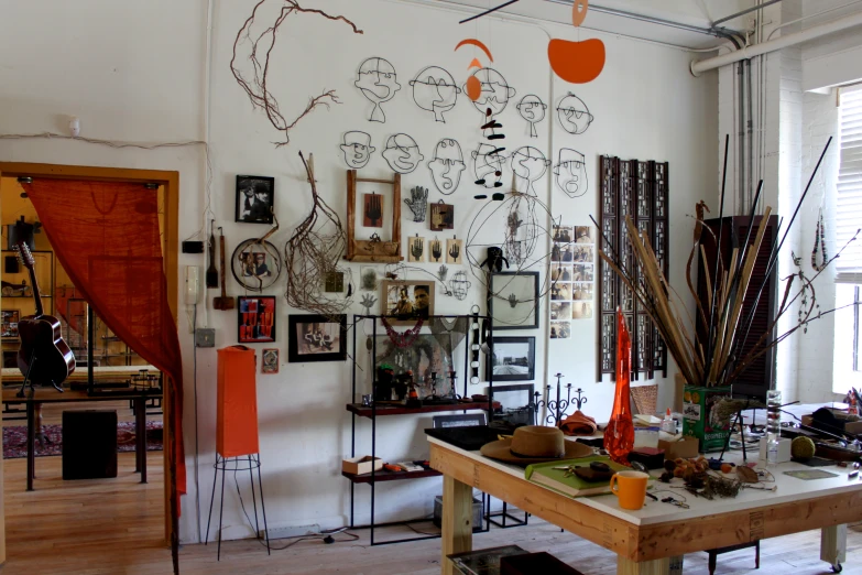 a living room filled with lots of items on top of a table