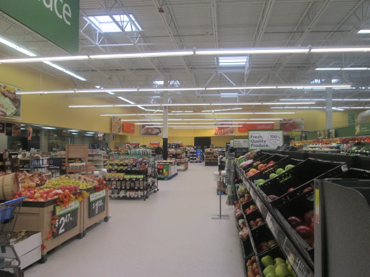 the inside of a grocery store showing a variety of fruits and vegetables