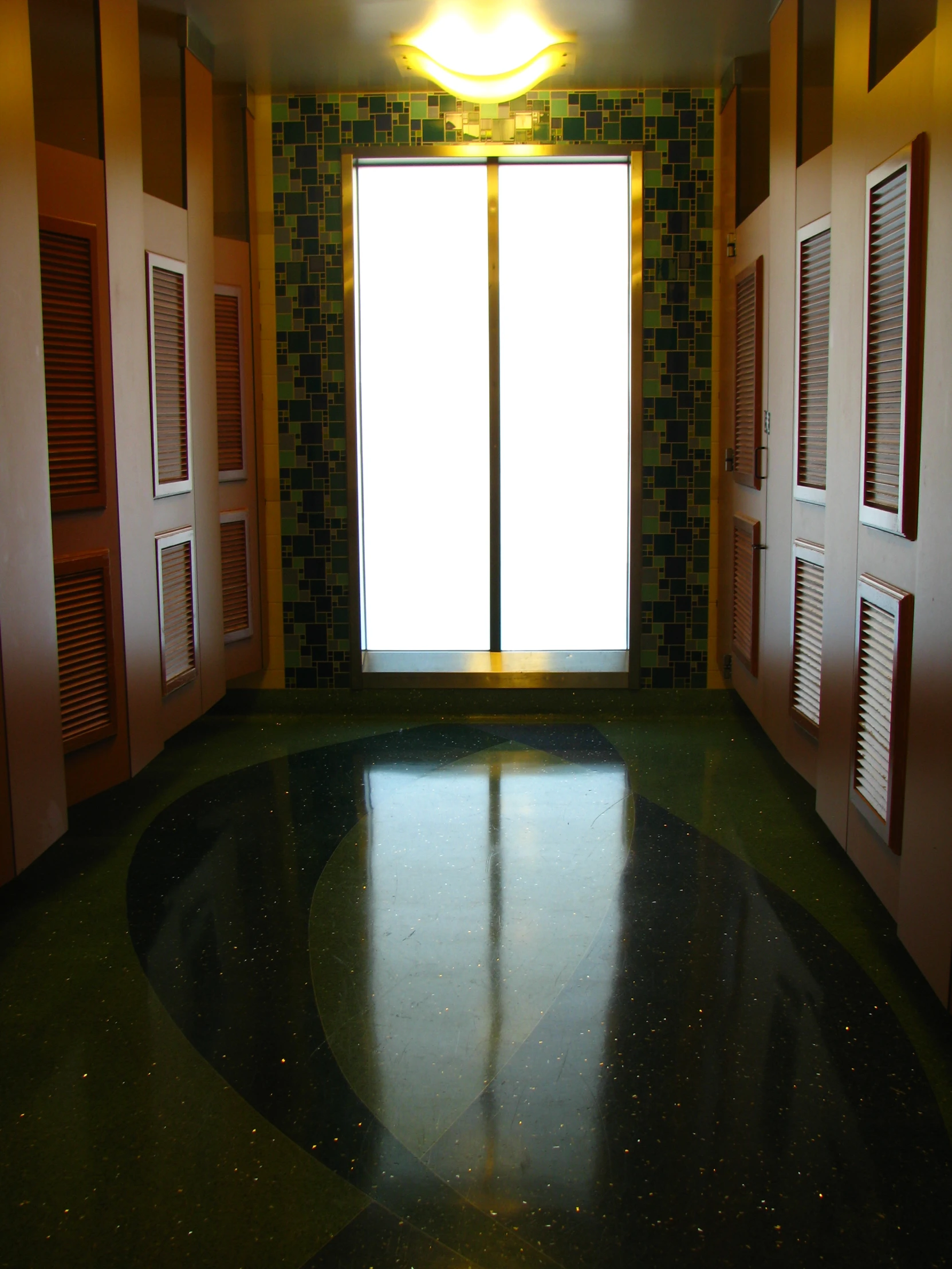 a hallway with multiple doors on each side