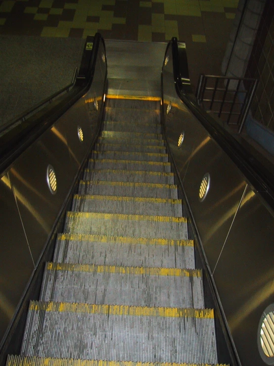 a very long stairway with a very bright light