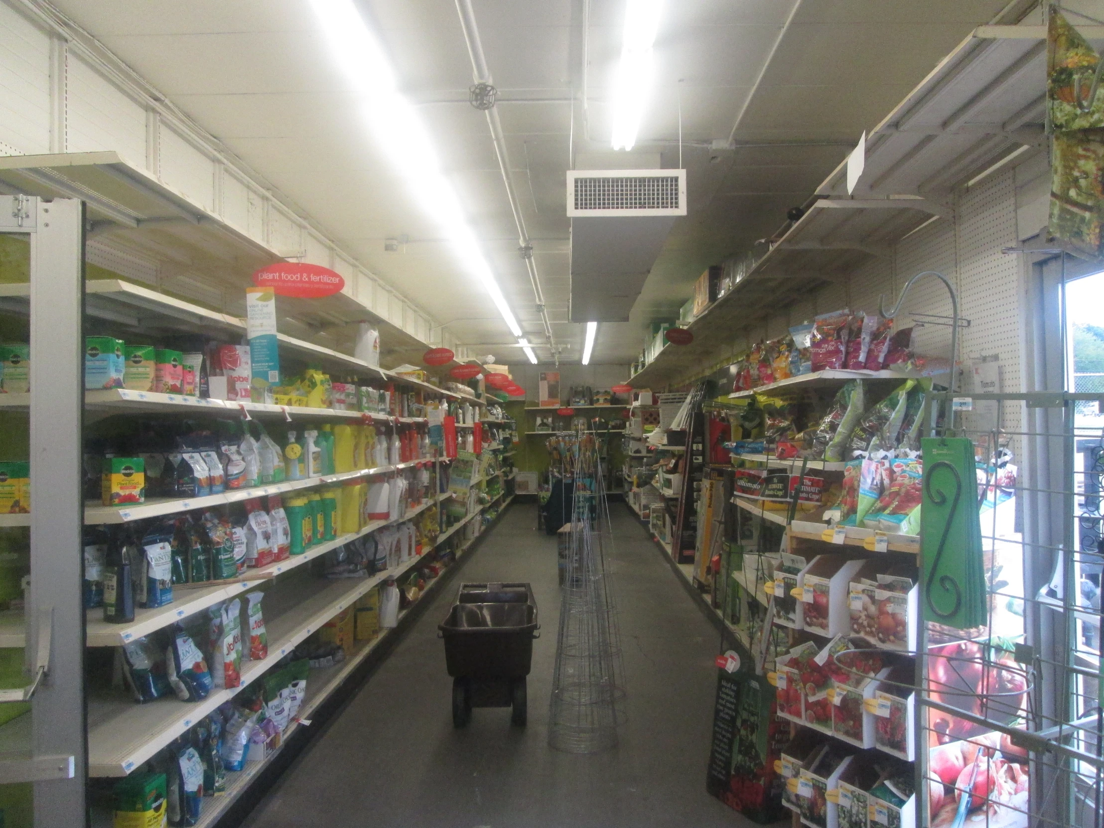 there are two aisles with shelves full of products