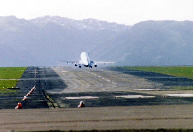 a airplane with its landing gear down on the runway