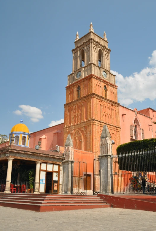 an old stone building with a clock tower in the center