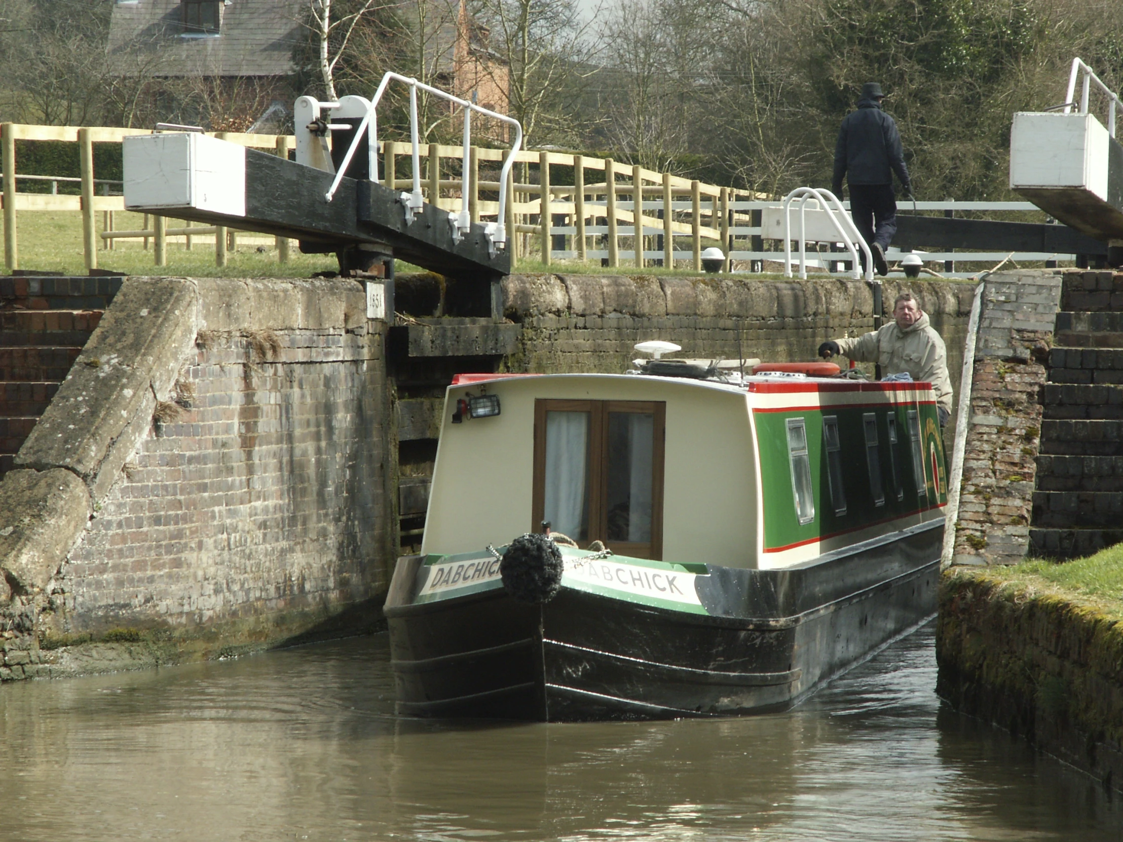 a man that is standing on top of a boat