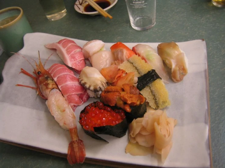 different types of sushi on a napkin on the table