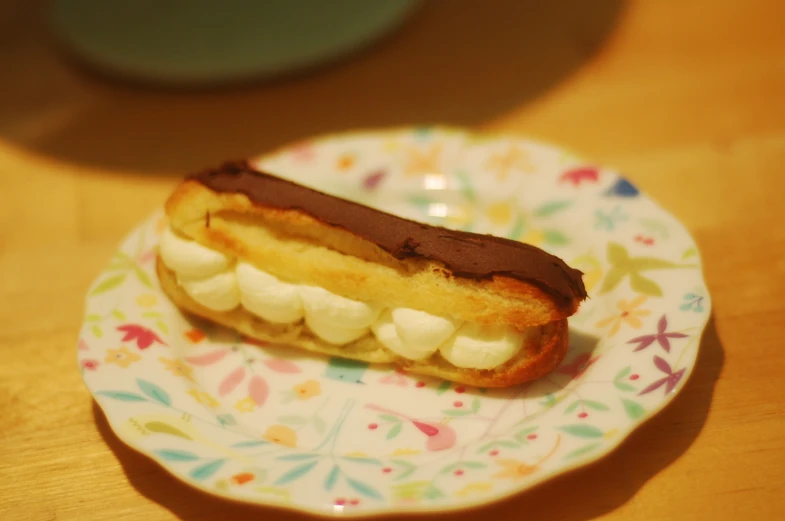 a sandwich on a plate with marshmallows on it