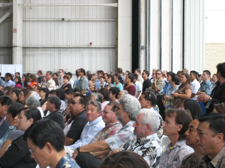 crowd of people in an outdoor facility with wall open