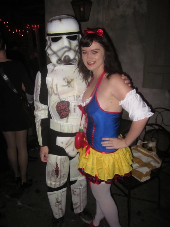 two people are standing in costumes on their body