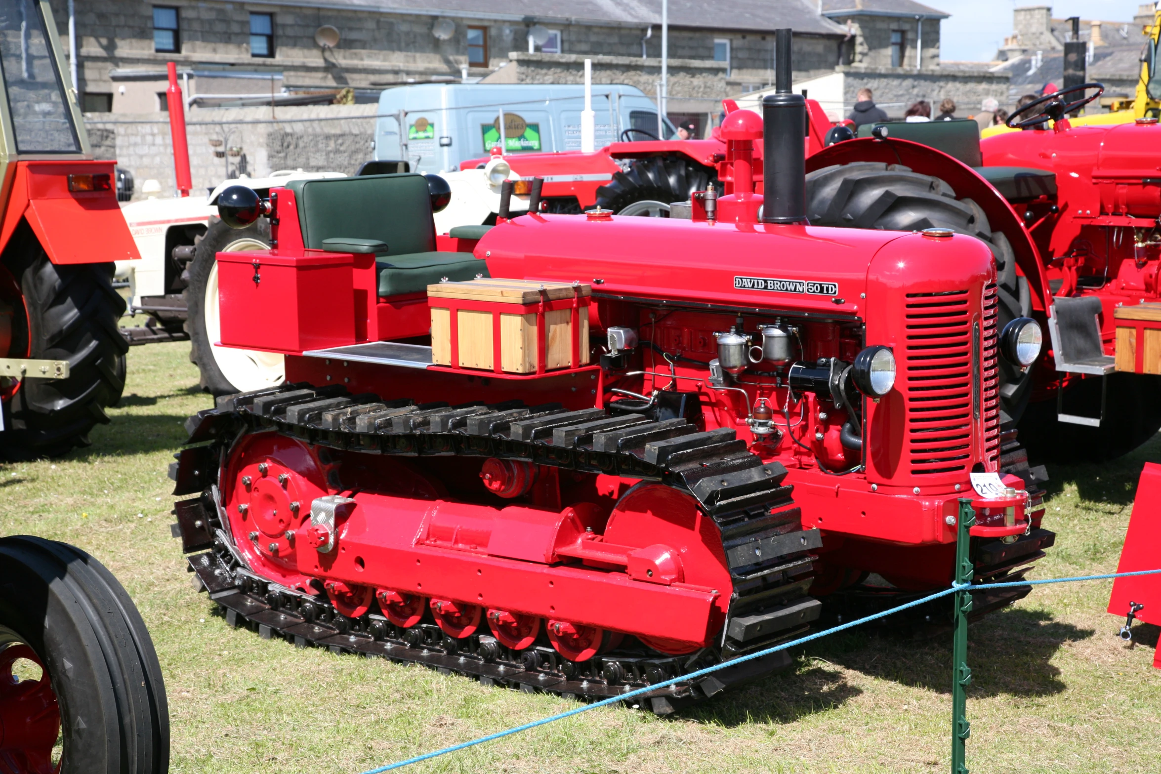 there are a bunch of small tractors on display