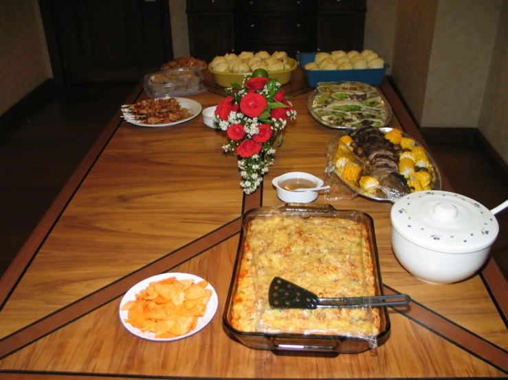 a wooden table topped with lots of food