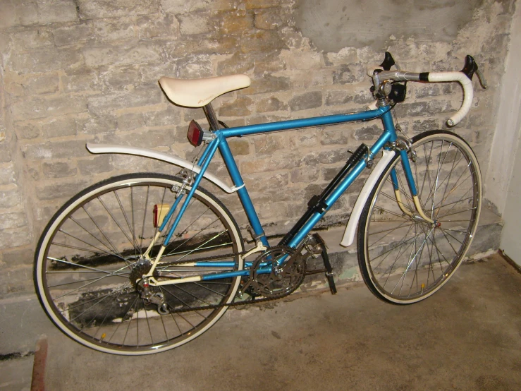 a bike in a corner on the side of a wall