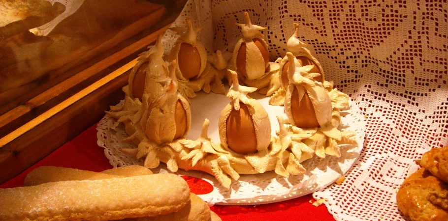 the plate is set with several decorated cakes and cookies