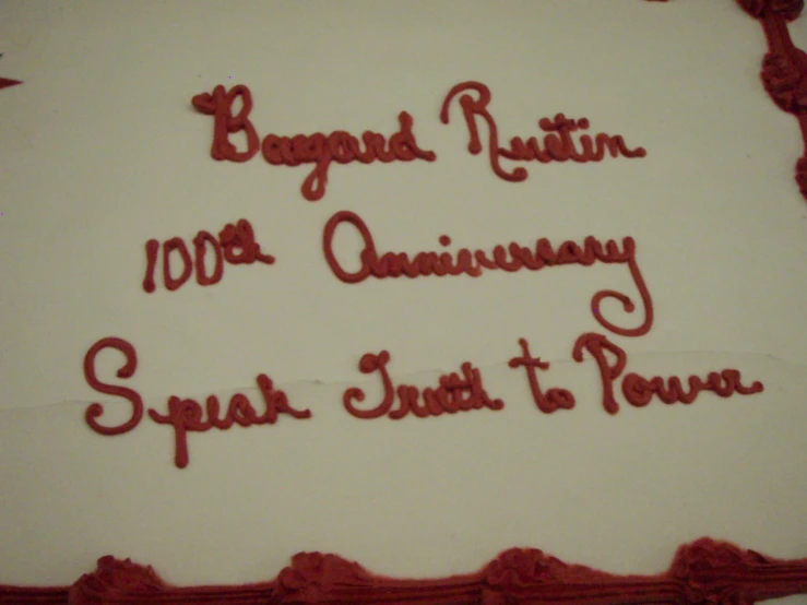 a close up picture of a cake with writing on it