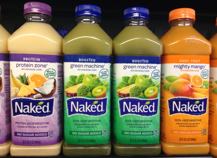 a shelf filled with bottles of  fruit drink