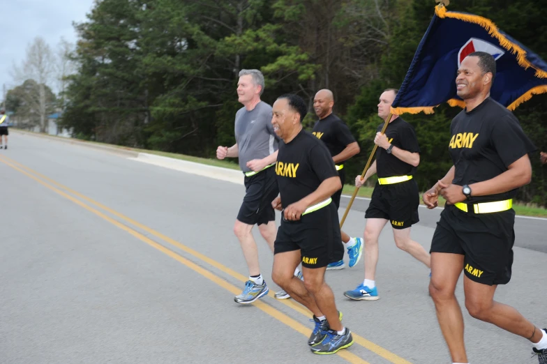 a marathon participant leads a parade along a street