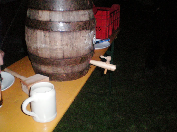 there is a wine barrel sitting on the table