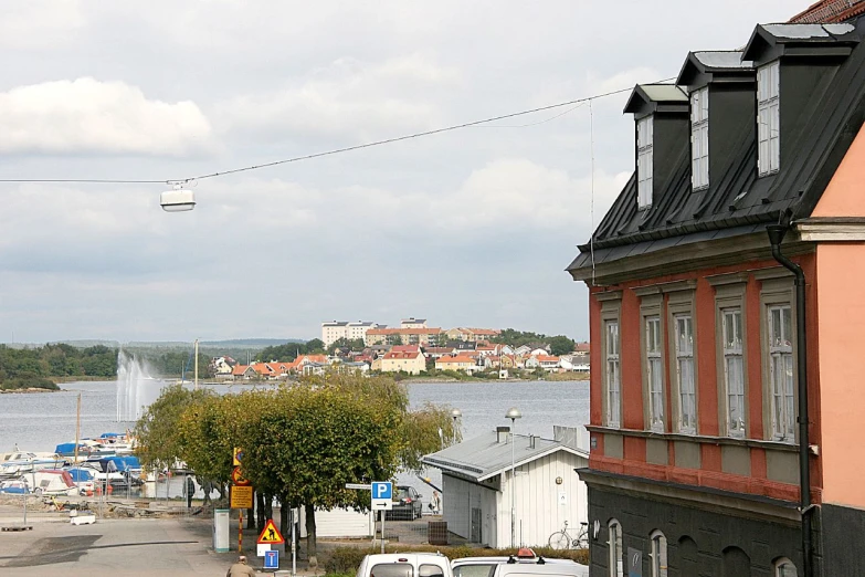 a boat is on the river in front of a building