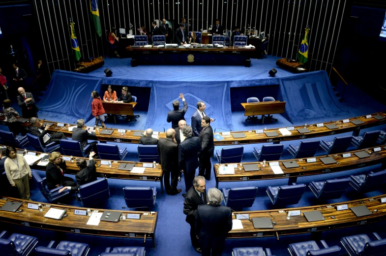 a large room full of people and lots of chairs