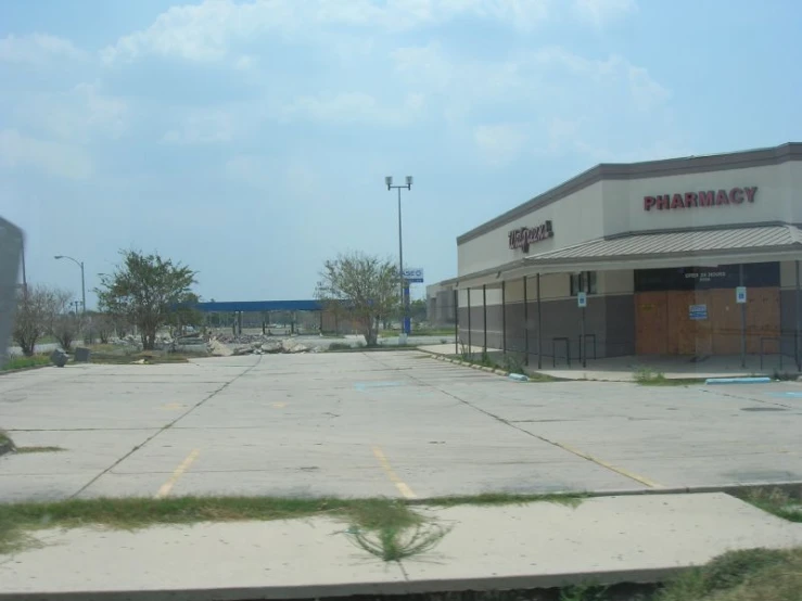 a deserted shopping center with no cars parked in front