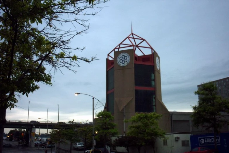 a building with a clock on top, at dusk