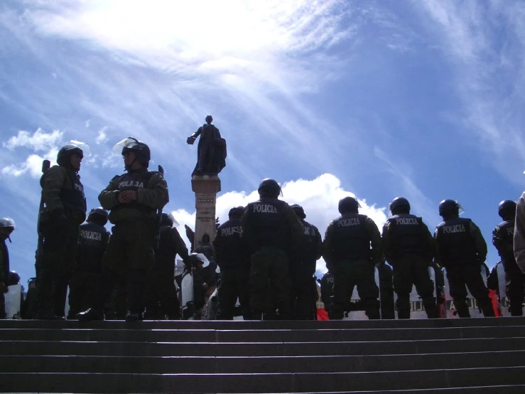 military men gathered outside of some buildings