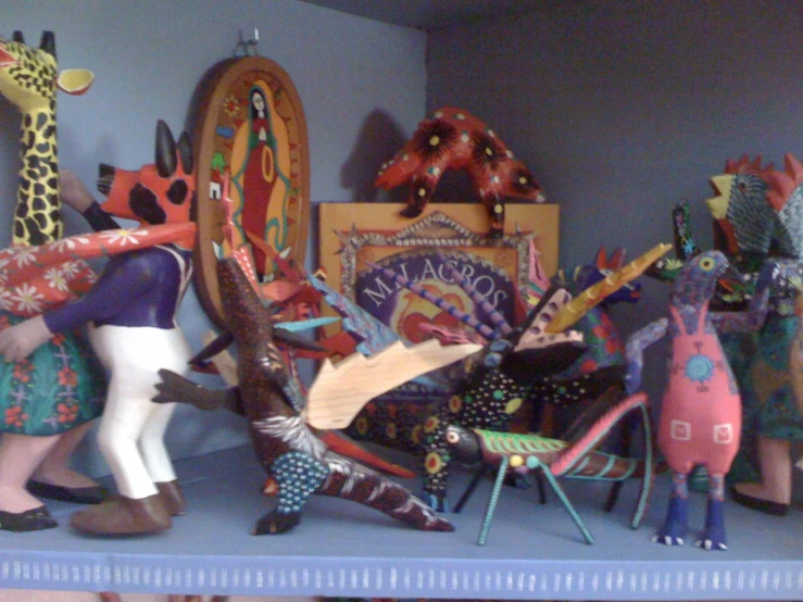 ceramic figures on top of the shelf