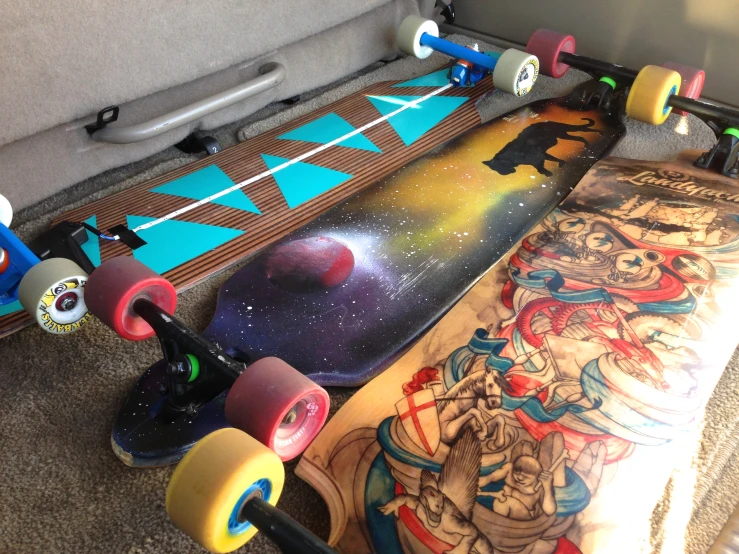 a room with several skateboards in the floor