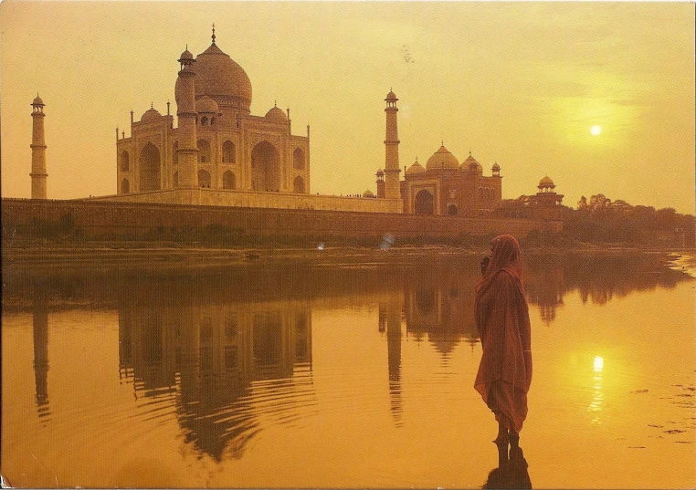 a person standing in front of a body of water