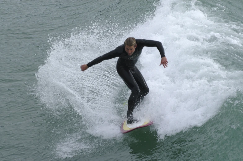 a man on a surfboard riding in the water