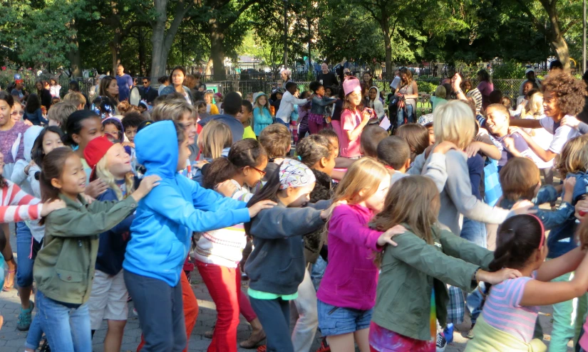 a crowd of people in the middle of a street