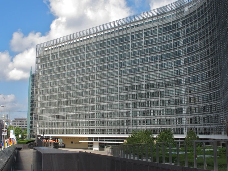 an architectural building with metal grating on the side of it