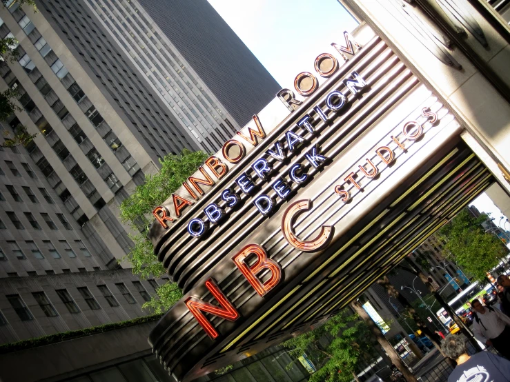 a large building with words that say nyc and an inscription